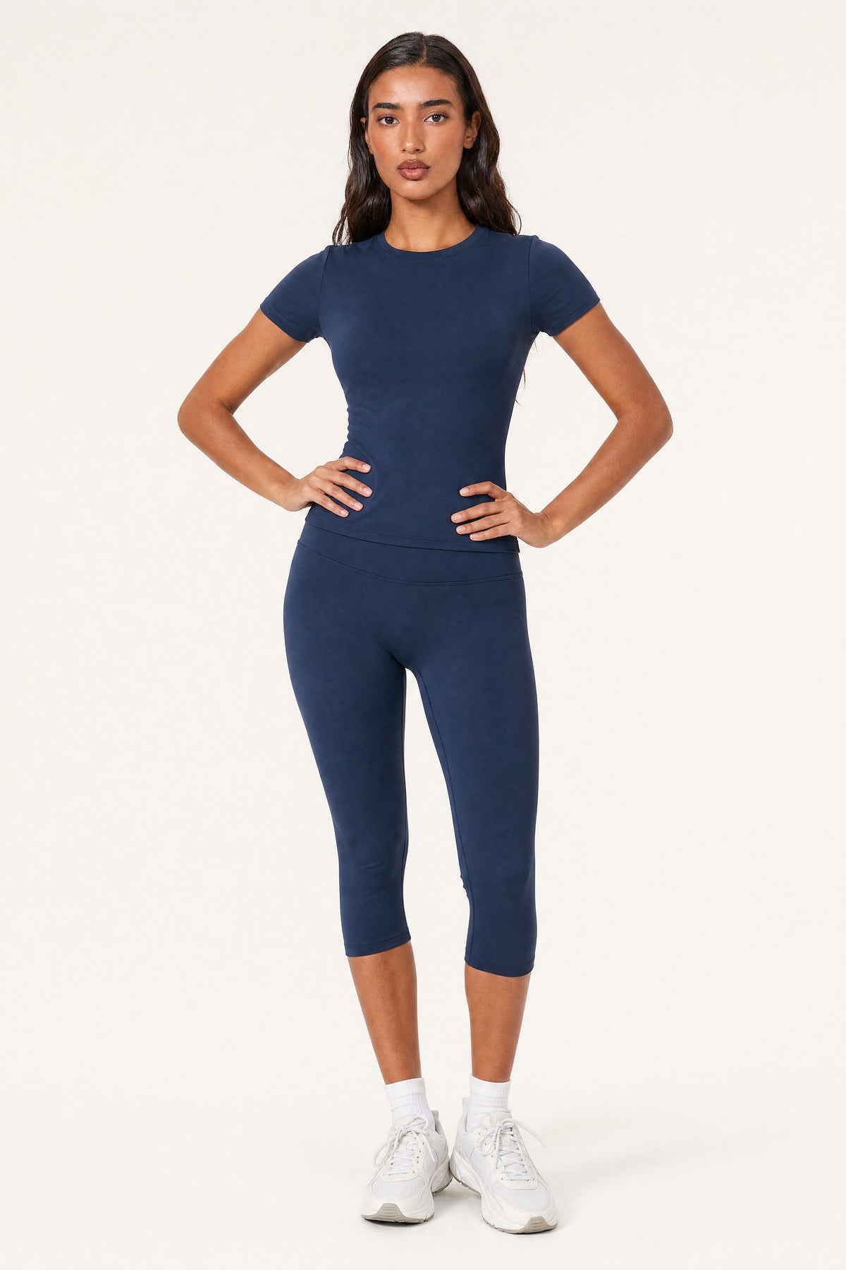 Model wearing the Capri Leggings Midnight