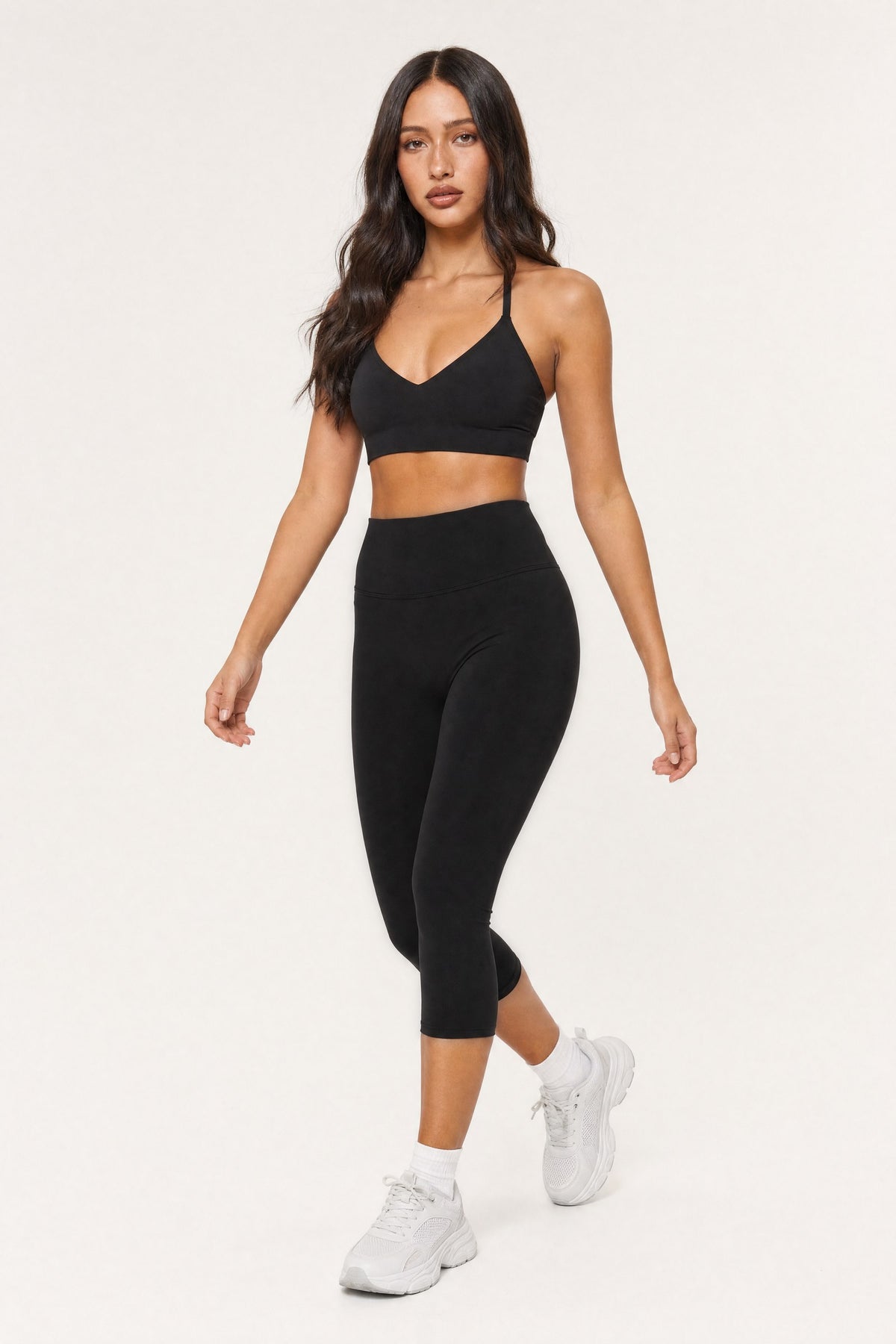 Model wearing the Capri Leggings Onyx